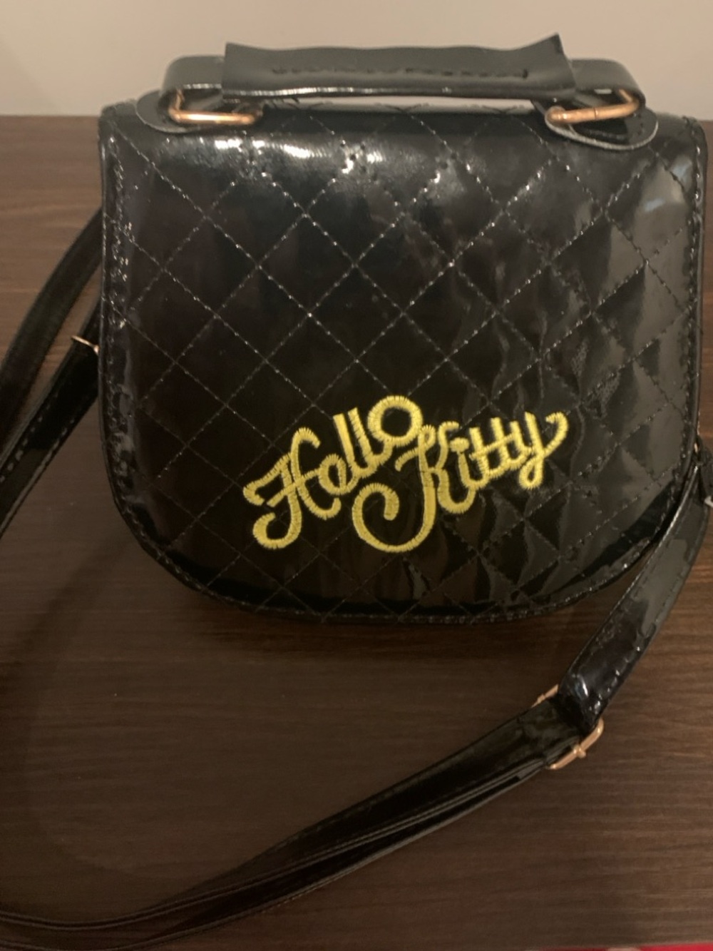Hello Kitty Black Quilted Crossbody with Yellow Script Logo